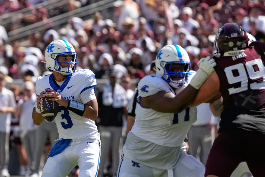 Kentucky quarterback Kenny Minchey (3) throws a pass against Texas A&M during the first half of an NCAA college football game Saturday, Sept. 19, 2026, in College Station, Texas. (AP Photo/David J. Phillip)