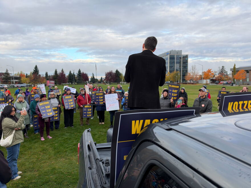Rev. Matt Schultz speaks to a crowd of about 100 people at Delaney Park Strip in Anchorage who protested President  Trump and his administration.