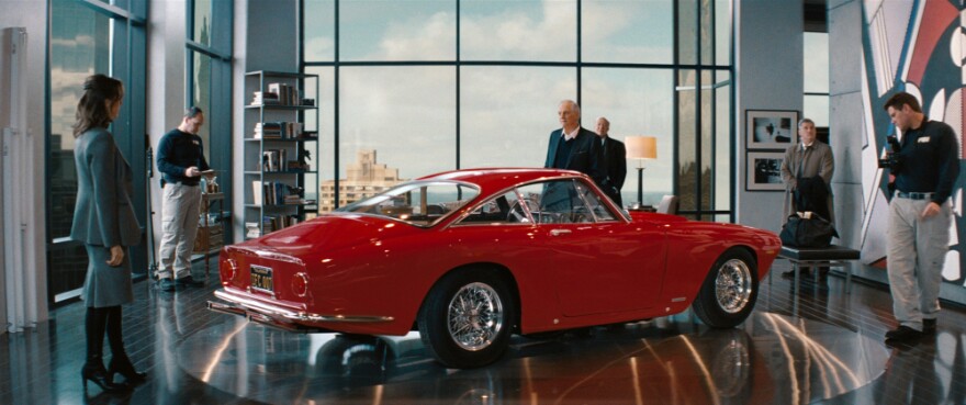 <strong>Seeing Red:</strong> Alan Alda (center, with Tea Leoni) and the Ferrari he keeps in his luxury-high-rise living room are the targets of both the payback plot and an FBI investigation.<em></em>