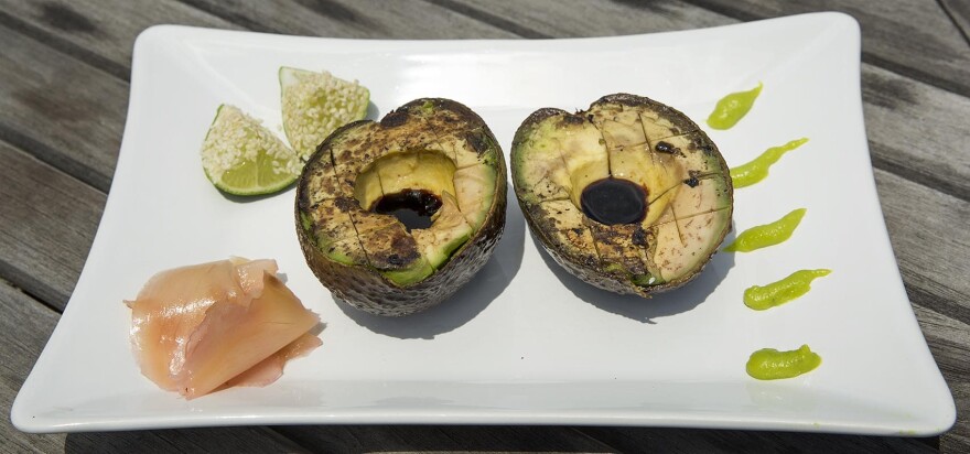 Grilled avocado with tamari, pickled ginger and lime with sesame seeds. (Robin Lubbock/WBUR)