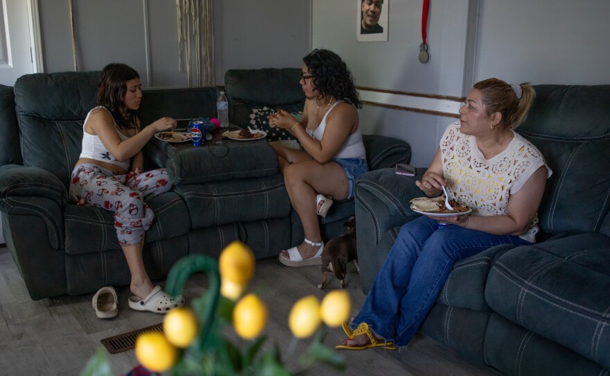 Edilberto Espinoza Sierra's family including his sister Elena Espinoza Sierra, left, and cousin Amy Sierra, center, eat lunch at his family's home in Wallace on April 17, 2026. Espinoza Sierra was shot and killed by the Wilmington Police Department in the early morning hours of March 8 following an incident in a downtown Wilmington parking garage. Espinoza Sierra was incorrectly identified as a suspect before he was killed and now his family is seeking answer and accountability.