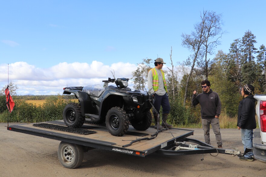 Dillon Cheney, Ralph Evalt and Patty Buholm with the landfill's new 4-wheeler.