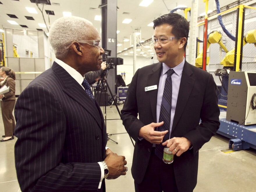 Memphis Mayor A C Wharton (left) with Jack Truong of Electrolux at the company's new plant. The city used a large incentive package to entice the company.
