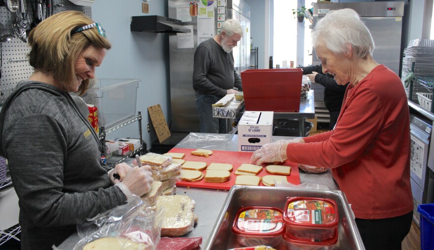 Volunteers make sandwiches