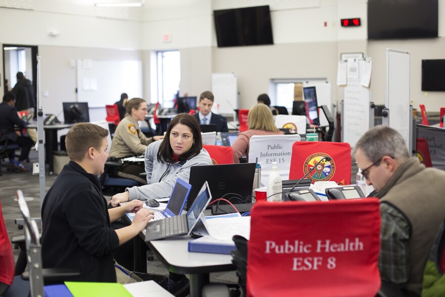 Teams work on responding to COVID-19 at the St. Louis County Office of Emergency Management in Ballwin on Friday.