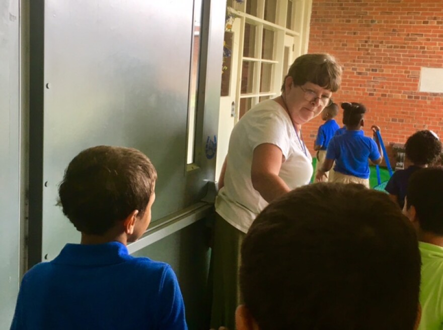 Joanne McGirt leads her students out of gym class. McGirt is one of only two teachers who applied to keep her job and was rehired at Southside-Ashpole Elementary when it became part of the Innovative School District.