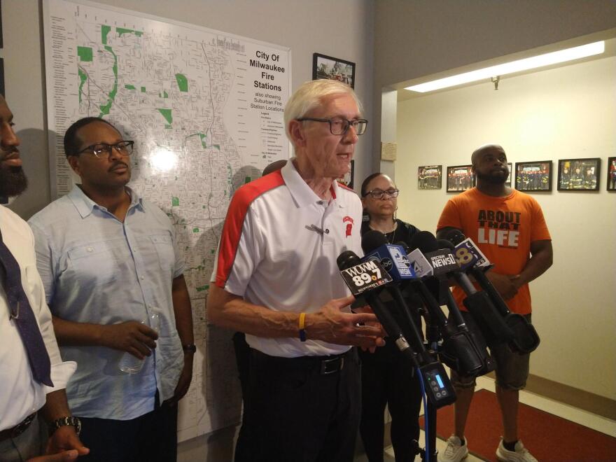 Evers speaks at a news conference at a Milwaukee Fire Department station along 27th St. The Milwaukee alderperson for the Garden Homes area, Ashanti Hamilton, is just left of Evers in the photo.