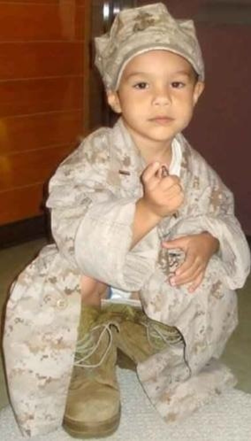 Sebastian, when he was just 3 years old, wearing his father's fatigues in 2008.