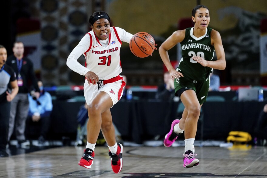 Fairfield's Sydney Lowery, left, drives past Manhattan's Jade Blagrove in the first half of an NCAA college basketball game during the championship of the Metro Atlantic Athletic Conference tournament, Saturday, March 12, 2022, in Atlantic City, N.J. Fairfield won 73-68.