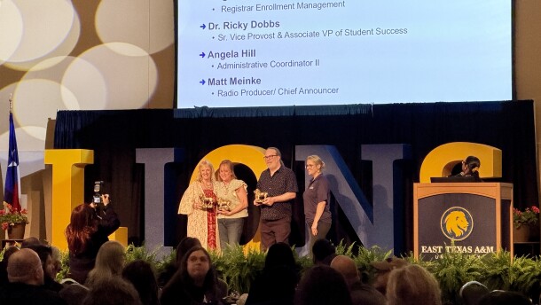 Matt Meinke accepts a token of appreciation as he's recognized for 30 years of service at ETAMU/KETR.