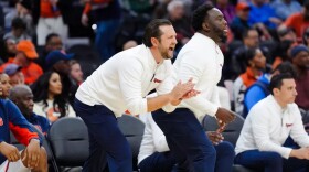 Assistant coach Dan Engelstad firing up the Orange