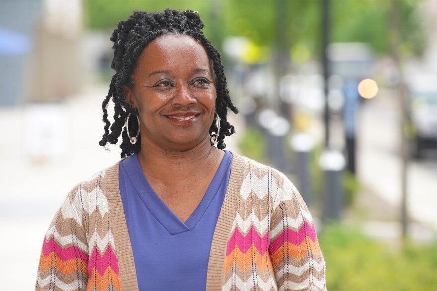 Dreama Mason Whitfield, scholar voice project lead with Akron Public Schools, stands for a photo in Downtown Akron.