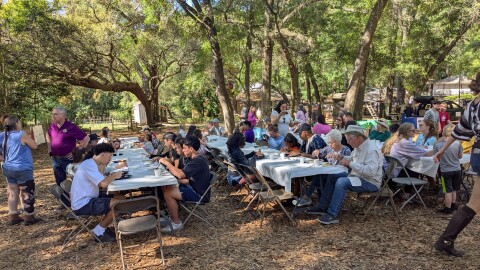 Pancakes, sausage, grits and eggs were enjoyed under the oaks during the museum's Pioneer Breakfast.