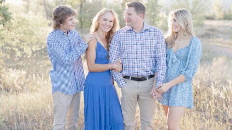 Tiffany Storrs (middle) with her family. Storrs is bilaterally deaf and has two cochlear implants.