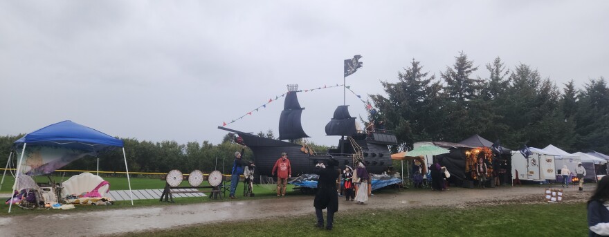 Festival attendees take photographs near the "Black Pearl" in Homer on Oct. 5, 2025.