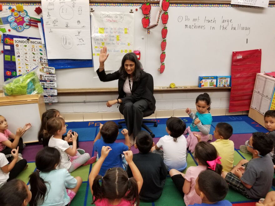 Ushma Shah, an assistant superintendent in Elgin, fills in for a kindergarten teacher.