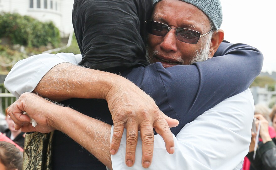 Prime Minister Jacinda Ardern hugs a mosque-goer at the Kilbirnie Mosque on Sunday in Wellington, New Zealand.
