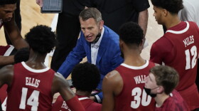 Alabama head coach Nate Oates speaks to his players during a time out during the first half of an NCAA college basketball game in Starkville, Miss., Saturday, Feb. 27, 2021. (AP Photo/Rogelio V. Solis)