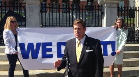State Rep. Geoff Diehl speaking outside the State House in Boston.