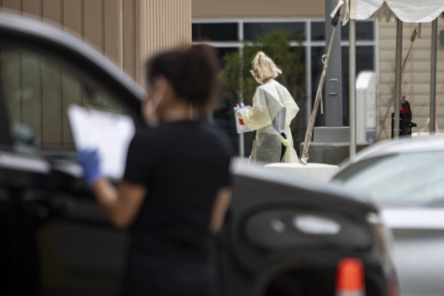 COVID-19 testing takes place at a drive-thru clinic in South Austin.