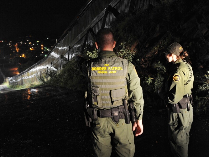 U.S. Border Patrol agents patrol along the border fence between Arizona and Mexico, July 28, 2010.
