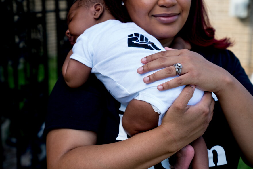 Arion D. Moore-Smith holds her son, Aamari, who was born during the Covid-19 pandemic. New Orleans, Louisiana, June 5, 2020.
