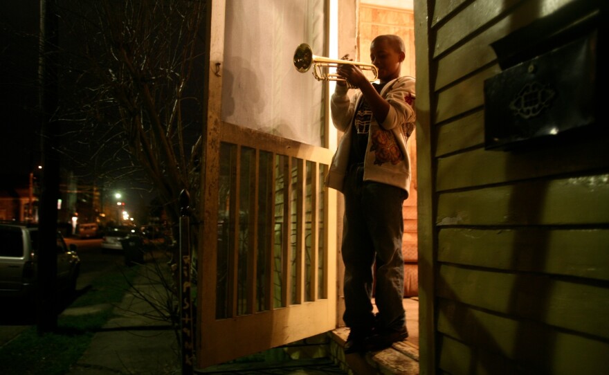 Eleven-year-old Jaron "Bear" Williams practices trumpet before marching in his first Mardi Gras season. <em>The Whole Gritty City</em> follows young student marching bands as they prepare for coveted spots in the New Orleans parade.