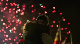 Andrea Estefania holds Mateo, 2, while they watch the fireworks show on Tuesday, July 4, 2023 during Fair St. Louis at the Gateway Arch. 