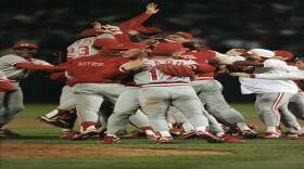 Members of the Cincinnati Reds celebrate on the field of Oakland Coliseum following their 2-1 win over the Oakland Athletics which clinched the World Series, Saturday, Oct. 20, 1990, in Oakland, Calif.
