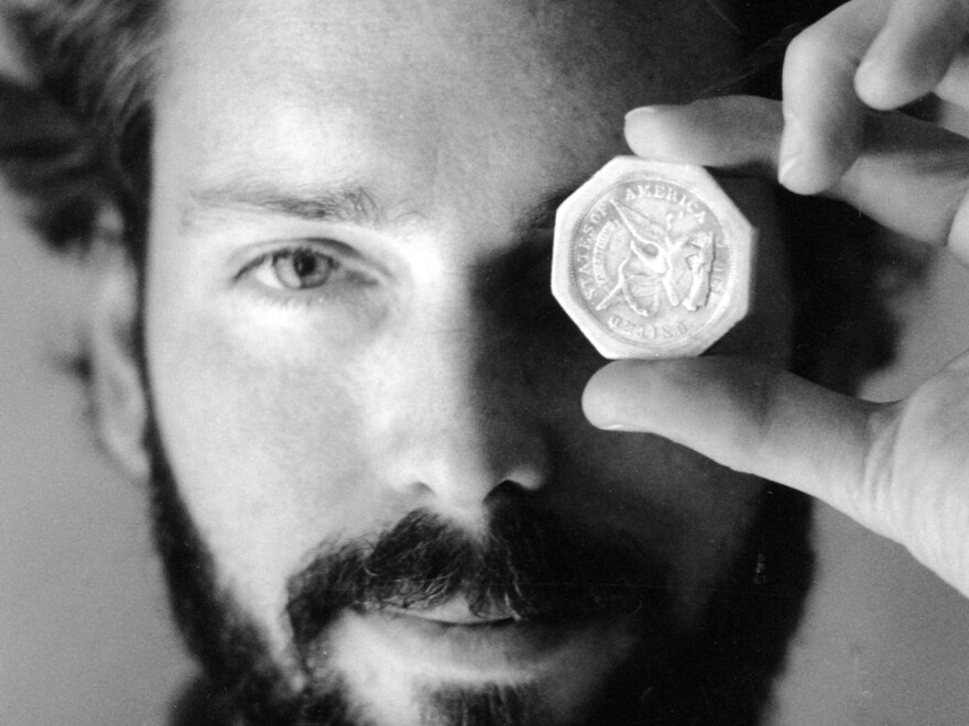 A November 1989 photo of Tommy Thompson holding a $50 pioneer gold piece retrieved from the wreck of the SS Central America. Thompson, who had been on the lam for two years, was arrested on Tuesday.