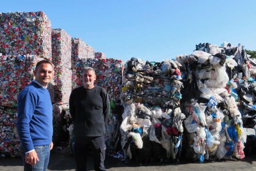Kostas Verganelakis (left), COO of the private waste management company WATT, and company shift manager Giorgos Koumantakis. Located outside Athens, WATT receives about 250 metric tons of waste from recycling bins every day. "If our plant was not here, then all this waste could go to the landfill," Verganelakis says.