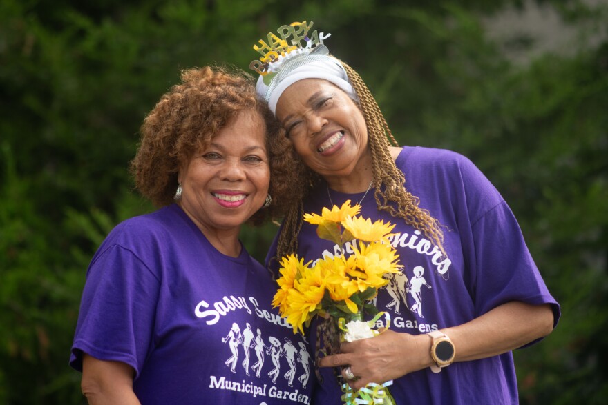Amanda Oliver (left) and Gladys Tandy pose for a photo after a line dancing class in September. The two women have known each other for three years. They were connected through a hospital program for patients who are at risk for loneliness and social isolation.