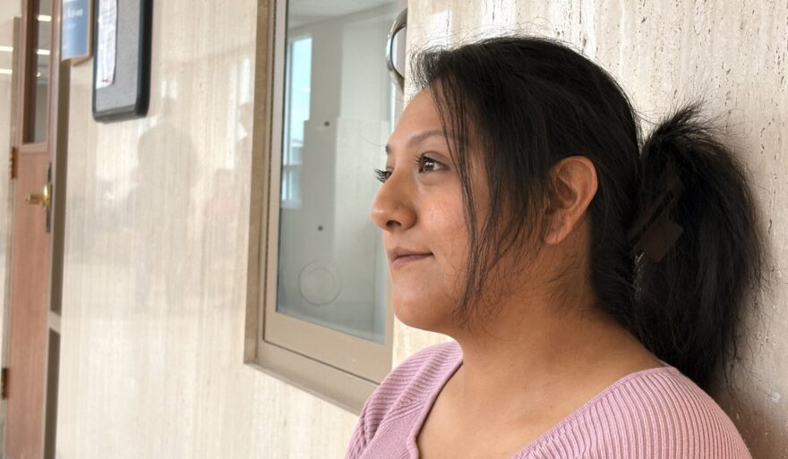 Mariana Villegas, 27, takes time away from work while her two elementary-age children are in school to attend a court hearing in her medical debt case on April 14, 2026, in Topeka. She is close to completing a program that will earn her a high school diploma.