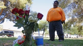 Margarito Castro, father of Manuel "Manny" Castro Garcia, 19, visits his son's grave at a cemetery Thursday, July 14, 2016, in Phoenix. The teen was killed in June, and is one of a growing number of victims associated with a serial killer according to police. (Ross D. Franklin/AP)