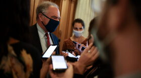 Sen. Tim Kaine (D-VA) speaks to reporters outside the Senate Chambers during a series of votes in the U.S. Capitol Building in Washington, DC.