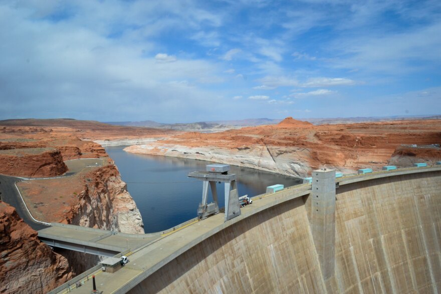 The fallen water levels of Lake Powell, and the bathtub ring left behind, are seen at Glen Canyon Dam in Arizona, March 21, 2022.