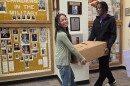 East Stroudsburg High School South students Mia Cabardo and Jahmere Grant carry a box of pants in the school's lobby on Friday. Members of the Key Club sorted 650 pairs of pants to distribute to area clothing closets.