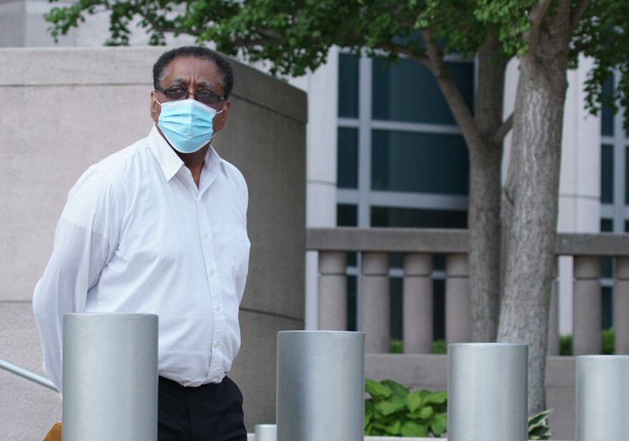 Anthony Weaver walks from the Thomas F. Eagleton U.S. Courthouse in downtown St. Louis.