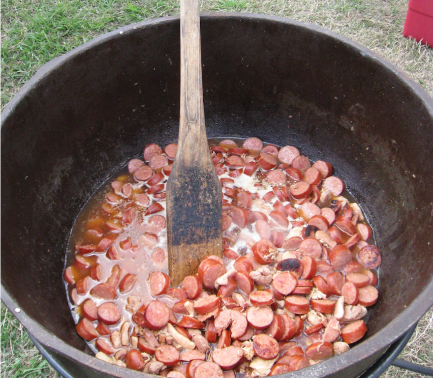 Jambalaya, cooked outdoors in heavy iron pots, is a common sight around Louisiana during football season. 