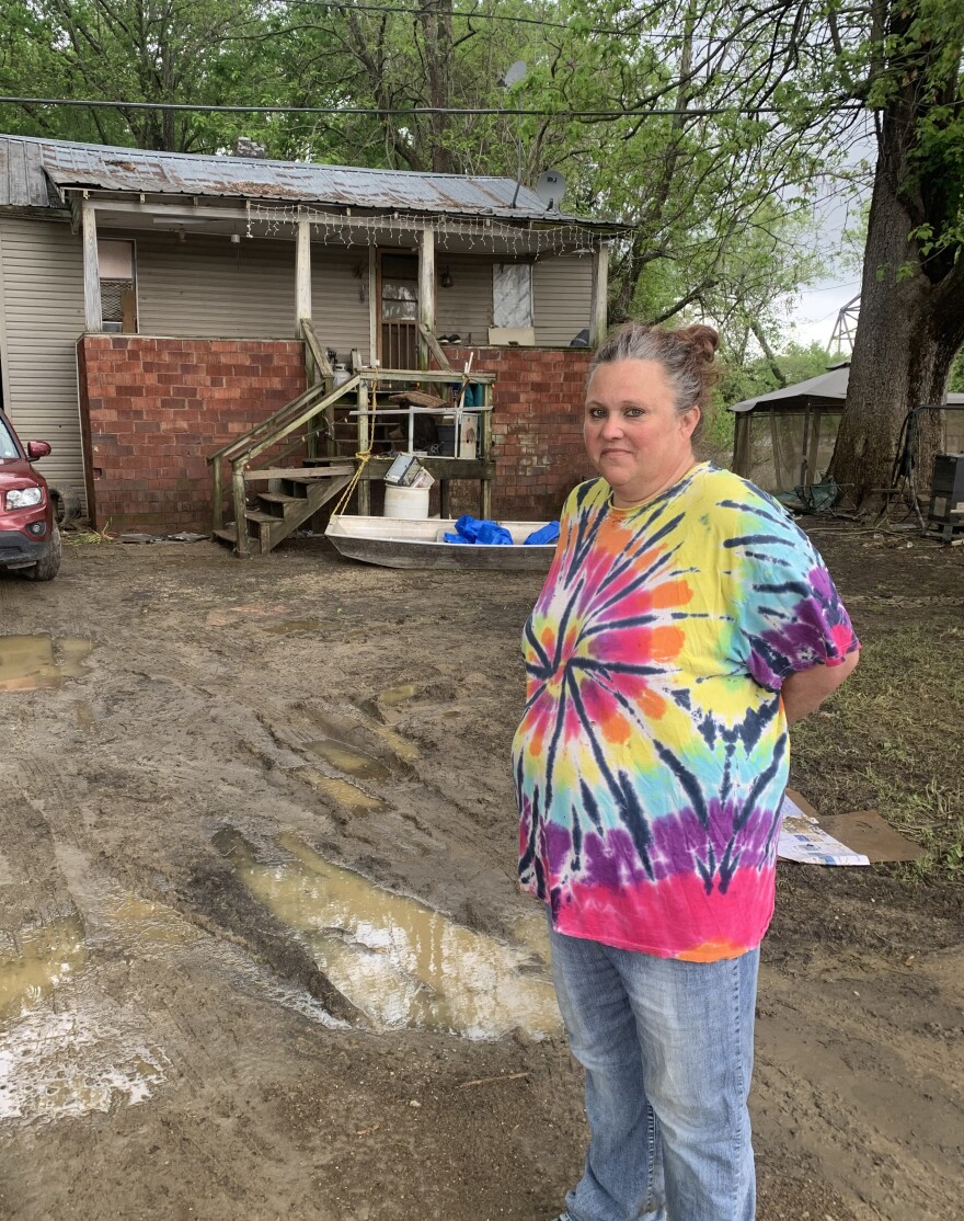 Bridgette Morris of Rumsey, KY stands outside her home on S. Canal St.