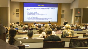 People listen to experts on public policy and energy development during a panel on data centers at Saginaw Valley State University on Aug. 8, 2026