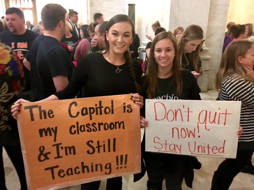 Rachel Campbell, left, and Davin Miller, elementary school teachers in Charleston, were among the thousands who demonstrated for better pay and benefits at the West Virginia State Capitol in 2018.