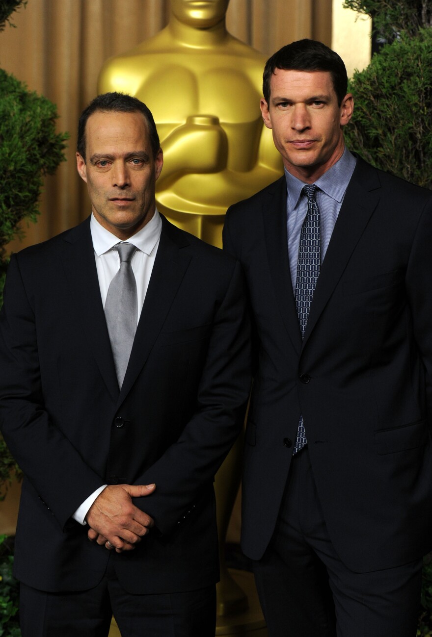Sebastian Junger (left) and Tim Hetherington are seen at an Academy Awards luncheon in February 2011. Junger's new documentary explores the life of Hetherington, who was killed in Misrata, Libya, in April 2011.