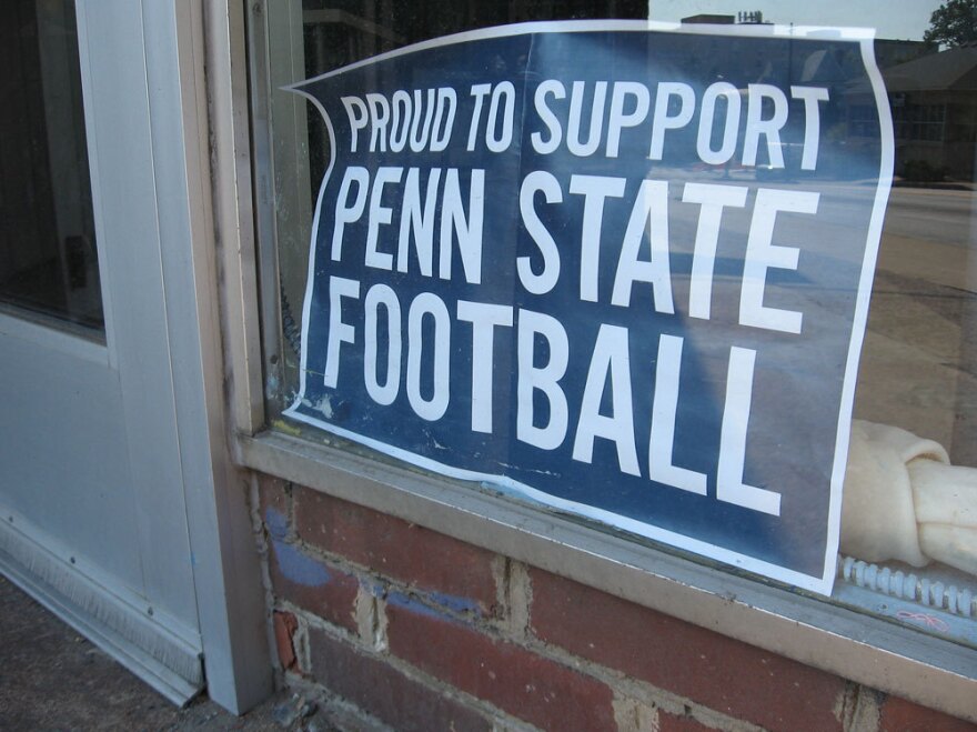 Signs on display around town are designed to show support for Penn State's football team as a new season begins.