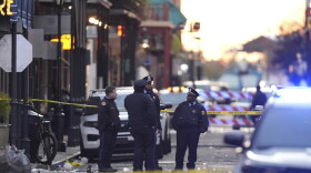 Emergency services attend the scene on Bourbon Street after a vehicle drove into a crowd on New Orleans' Canal and Bourbon Street, Wednesday Jan. 1, 2025. (AP Photo/Gerald Herbert)