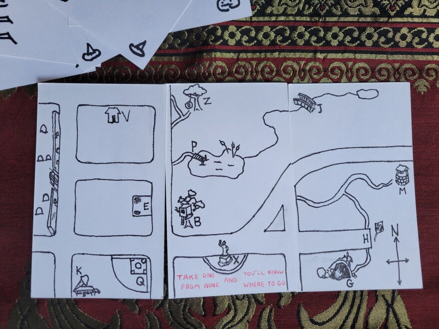 A map of some neighborhood streets on three small white cards