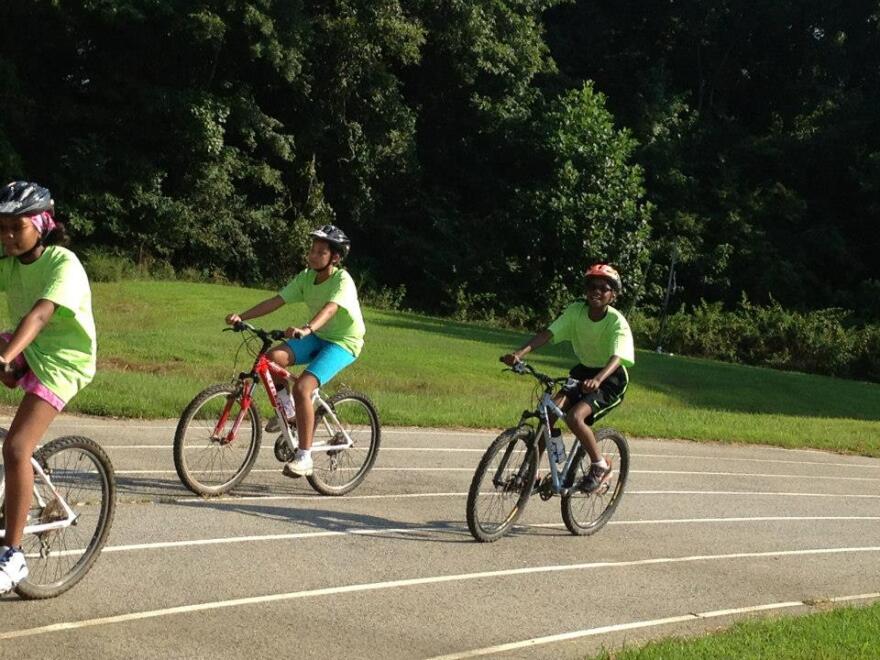 Two students at Durham's School for Creative Studies try out for the new cycling team. 