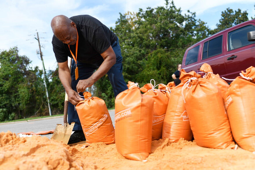 Residents pick up sandbags for storm preparation at the James Seals Jr. Parks & Recreation Center ahead of Hurricane Isaias' expected landfall along the Gulf Coast, Thursday, Oct. 8, 2026, in Mobile, Ala. (AP Photo/Octavio Jones)
