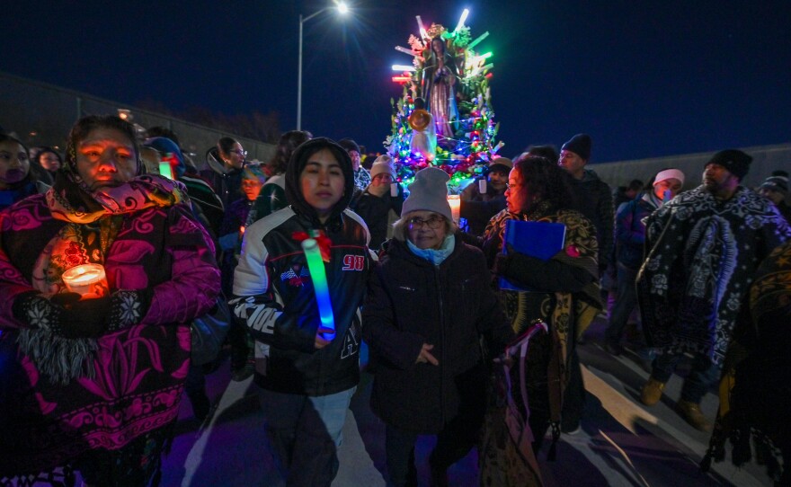 Sixta Marianna Galeno, 86, walks before the statue of Our Lady of Guadalupe over the South Street Bridge in Wilkes-Barre.
