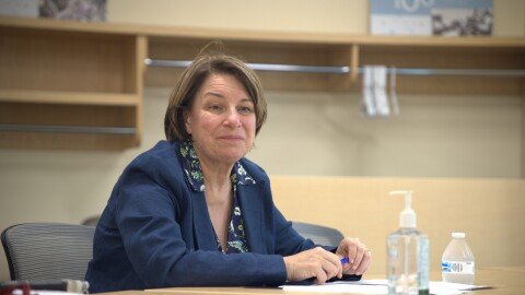 Sen. Amy Klobuchar listens to hospital administration July 25, 2025, while visiting Grand Itasca Hospital & Clinic in Grand Rapids.
